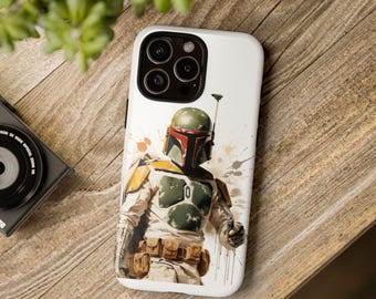 May include: A white smartphone case featuring a graphic illustration of a character wearing a green, yellow, and red helmet and armor. The design includes a utility belt, a blaster, and abstract paint splatter accents in shades of orange and brown.