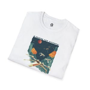 May include: White t-shirt with a graphic of X-Wing starfighters flying through space with the text "X-Wings for Victory!"