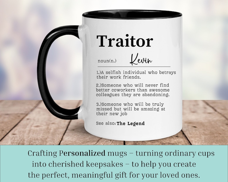 May include: White ceramic coffee mug with a black handle and black rim. The mug has a humorous definition of the word "Traitor" with the name "Kevin" printed on it.