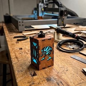 May include: A set of three ceramic mugs with a speckled, matte finish. The mugs are in shades of cream, light gray, and dark gray. Each mug has a simple, minimalist design, perfect for coffee or tea.