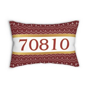 May include: Red and white patterned cushion with a gold stripe and the number 70810 printed in red.