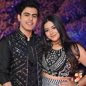 Black mirror work Nehru jacket styled with black ethnic outfit for Indian wedding occasion