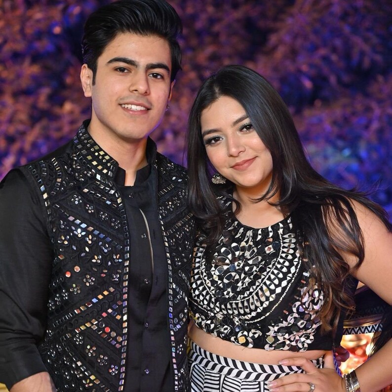 Black mirror work Nehru jacket styled with black ethnic outfit for Indian wedding occasion