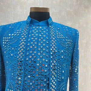 close-up of mirror embroidery on jacket – Kph Outfits