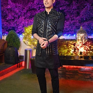 Black Nehru jacket set with kurta pajama styled for Indian wedding and festive wear