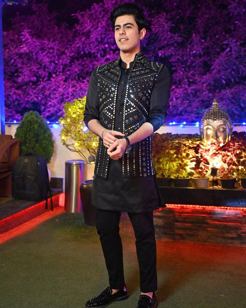 Black Nehru jacket set with kurta pajama styled for Indian wedding and festive wear
