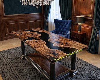 May include: A rectangular table featuring a live-edge wood slab with a central black resin river inlay. The table has four black fluted columns as legs and a lower shelf. The text Craftmen international is visible on the surface.