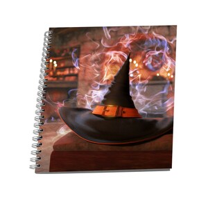 May include: A black witch's hat with an orange band and a gold buckle sits on a wooden surface in front of a fireplace with smoke and flames.