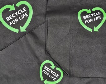 May include: Two black reusable shopping bags with green heart-shaped logos that say "Recycle for Life".