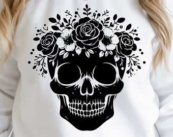 May include: White sweatshirt with a black floral skull graphic. The skull is surrounded by flowers and leaves.