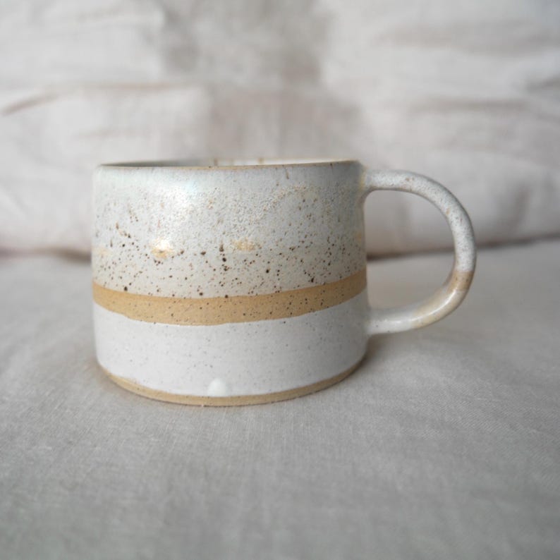 Earthy-toned stoneware mug, wheel thrown and handcrafted, showcasing Australian clay's natural beauty.