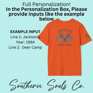 May include: Orange t-shirt with a deer camp graphic. The shirt features the text "Jackson's Deer Camp" with a deer head and mountain design. The shirt also has a small American flag design on the sleeve. The text "Full Personalization" is at the top.