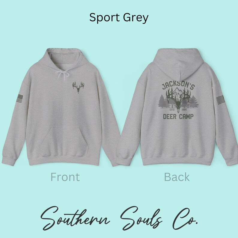 May include: Sport Grey hoodie with a front deer antler graphic and a back graphic that reads "Jackson's Deer Camp Est. 1984". The hoodie has a front pocket and a small American flag on the sleeve. The brand name "Southern Souls Co." is at the bottom.