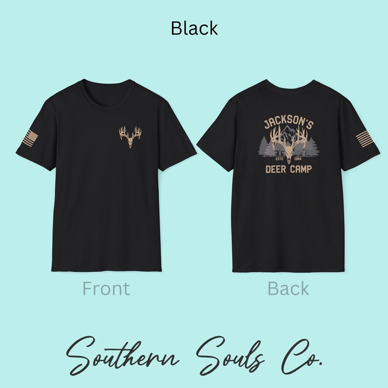 May include: Black t-shirt with a deer antler graphic on the front and a small American flag on the sleeve. The back of the shirt features a deer camp design with the text "Jackson's Deer Camp ESTD 1984". The text "Southern Souls Co." is at the bottom.
