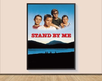 May include: A movie poster for the film "Stand By Me" featuring four young boys standing in front of a lake and mountains. The poster has a blue sky background with the title "Stand By Me" in red letters.
