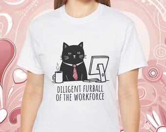 May include: White t-shirt with a black cat wearing a red tie and sitting at a computer. The text on the shirt reads "Diligent Furball of the Workforce".