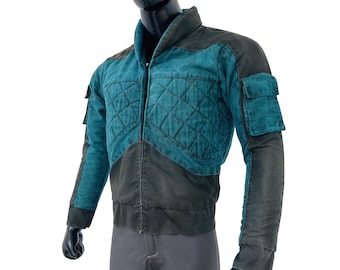 May include: A teal and black quilted jacket with a zipper closure and two pockets on the sleeves.