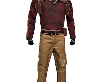 May include: A brown and red long-sleeved shirt with a brown leather vest and a brown belt. The shirt has a distressed look and the vest has pockets and straps. The person is wearing brown pants with cargo pockets and knee pads.