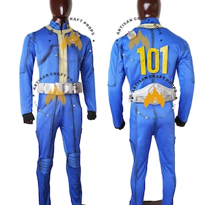 May include: A blue jumpsuit with gold and silver accents, featuring a front zipper and a white belt. The back displays the number "101" in yellow. The suit has black cuffs and knee padding. The text "ARTISAN CRAFT PROPS" and "HANDMADE WITH PASSION" are visible.