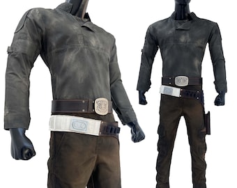 May include: A dark green, distressed, long-sleeved shirt with a brown leather belt and a silver buckle. The shirt has a collar and a pocket on the left chest. The belt has a white fabric band with a silver buckle. The pants are brown and have cargo pockets on the sides.