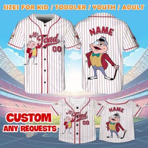 May include: White baseball jersey with red stripes and a cartoon frog wearing a hat and holding a cane. The jersey has the text "Mr. Toad" and "00" on the front and "NAME" on the back. The jersey is available in sizes for kids, toddlers, youth, and adults.