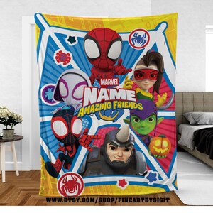 May include: A Marvel "Amazing Friends" blanket featuring Spider-Man and other characters. The blanket has a blue and yellow background with the Marvel logo and the text "Name Amazing Friends".