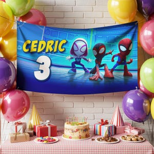 May include: A birthday party scene with a banner featuring the name "Cedric" and the number "3" alongside cartoon Spider-Man characters. The table is set with a cake, gifts, and party favors, surrounded by colorful balloons.