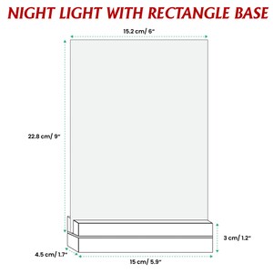 May include: A diagram of a night light with a rectangle base. The dimensions are labeled in both centimeters and inches. The night light is 9 inches (22.8 cm) tall and 6 inches (15.2 cm) wide. The base is 1.7 inches (4.5 cm) tall and 5.9 inches (15 cm) wide.