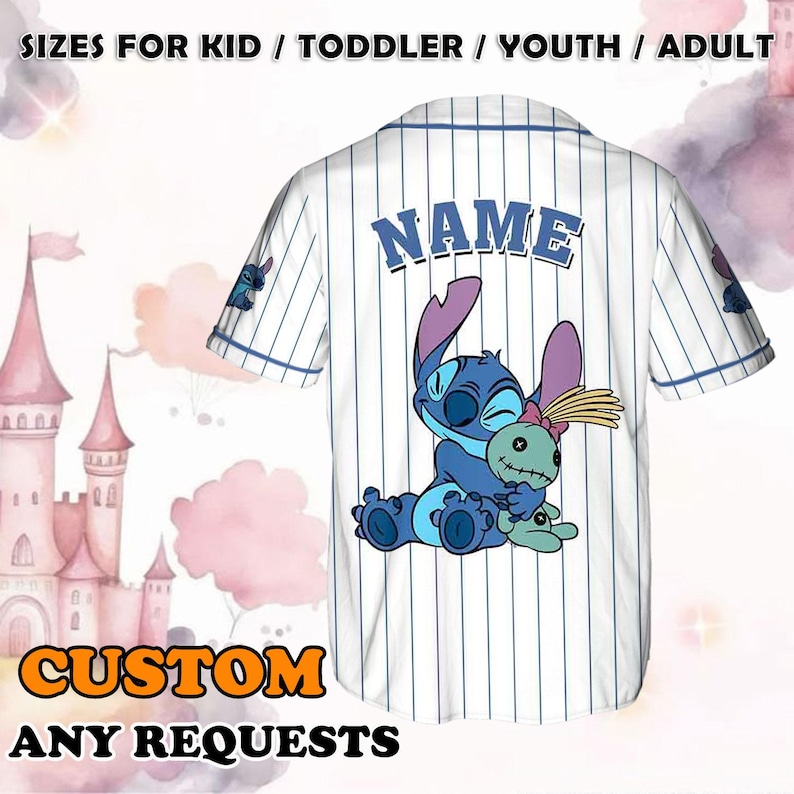 May include: White baseball jersey with blue stripes and a blue Stitch character holding a green doll. The jersey has the word "NAME" printed on the back.