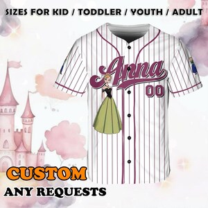 May include: A white baseball jersey with purple stripes, featuring a cartoon image of a girl in a green dress with the name "Anna" and the number "00" in purple text. The jersey is available in sizes for kids, toddlers, youth, and adults. The text "CUSTOM ANY REQUESTS" is at the bottom of the image.