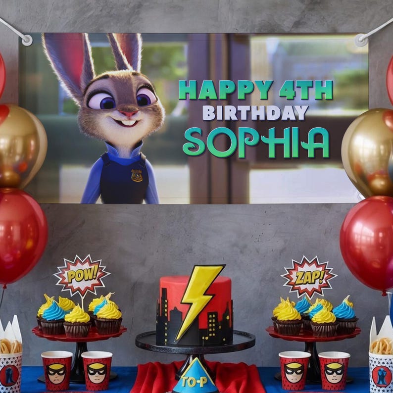 May include: A birthday party scene with a banner featuring Judy Hopps from Zootopia and the text "HAPPY 4TH BIRTHDAY SOPHIA." The table is decorated with a cake, cupcakes, balloons, and superhero-themed cups.