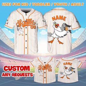 May include: White and orange baseball jersey with a cartoon seagull graphic and the text "Scuttle 00". The jersey is available in sizes for kids, toddlers, youth, and adults.