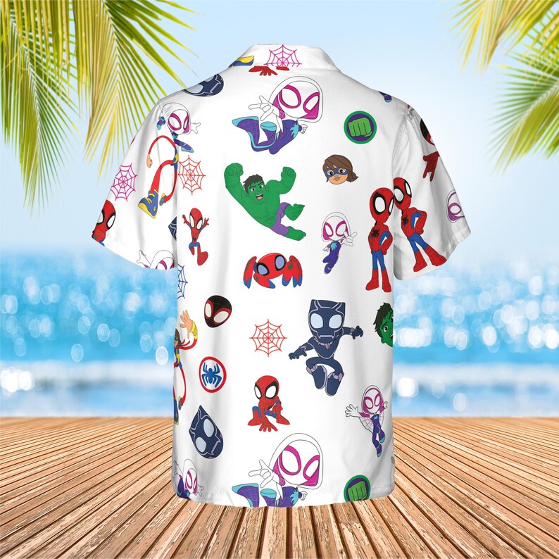 May include: A white short-sleeve button-down shirt featuring an all-over print of various cartoon superhero characters including Spider-Man, Ghost-Spider, Hulk, and Black Panther, interspersed with red spider web icons and green fist symbols.