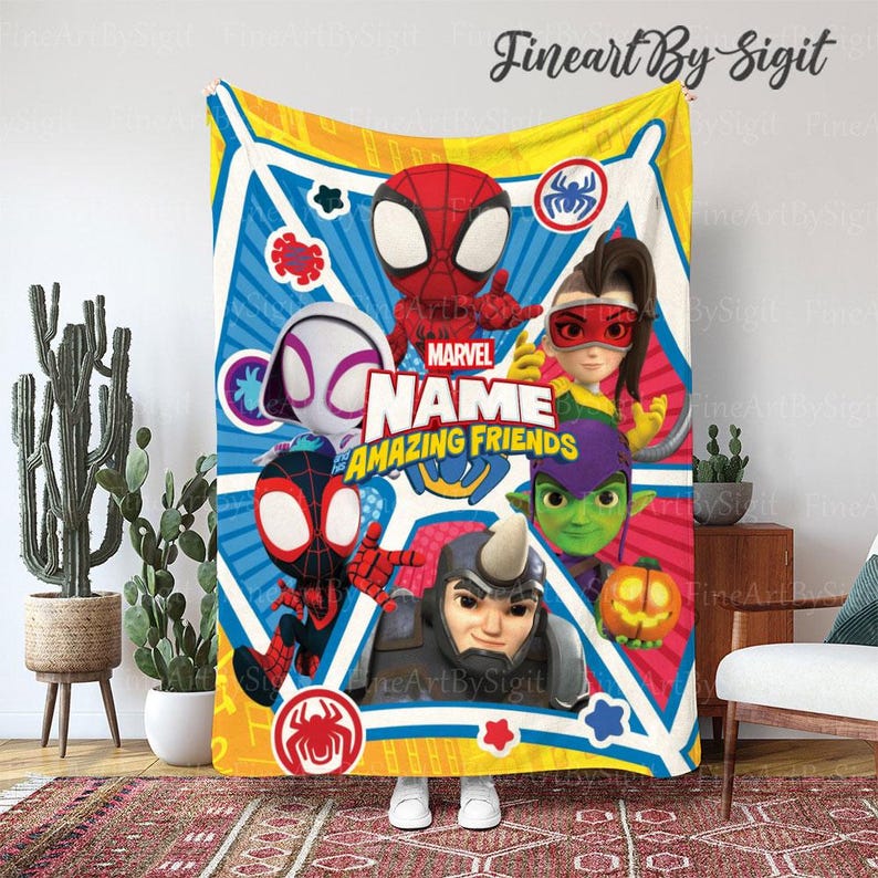 May include: A colorful Marvel "Amazing Friends" blanket featuring cartoon characters Spider-Man, Spider-Gwen, and others. The blanket has a yellow border and a blue and red background with the Marvel logo.