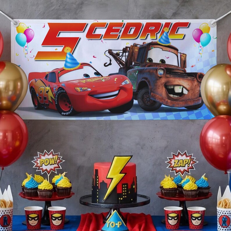 May include: A birthday party scene featuring a banner with the name "Cedric" and the number "5", along with cartoon cars. The table is decorated with a cake, cupcakes, and superhero-themed cups. Balloons in red and gold add to the festive atmosphere.