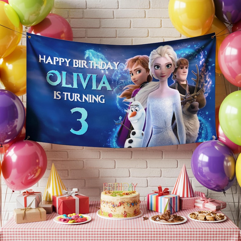 Puede incluir: Una pancarta de cumplea&ntilde;os con el texto "Happy Birthday Olivia is turning 3" con personajes de la pel&iacute;cula Frozen. La pancarta se muestra con globos, regalos, una tarta y gorros de fiesta.