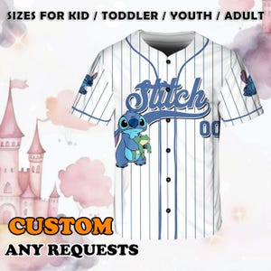 May include: White baseball jersey with blue stripes and a blue Stitch character holding a green frog. The jersey has the word "Stitch" in blue cursive lettering and the number "00" in blue. The text "CUSTOM ANY REQUESTS" is at the bottom of the image.