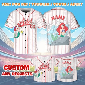 May include: White baseball jersey with red pinstripes, featuring the name "Ariel" and the number "00". The front displays a mermaid graphic, while the back has a mermaid illustration and the word "NAME". The text "SIZES FOR KID / TODDLER / YOUTH / ADULT" and "CUSTOM ANY REQUESTS" are also visible.