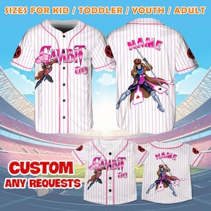 May include: White baseball jersey with pink pinstripes, featuring the word "GAMBIT" and a character graphic. The jersey has a button-up front and the text "SIZES FOR KID / TODDLER / YOUTH / ADULT" at the top. The bottom of the image says "CUSTOM ANY REQUESTS".