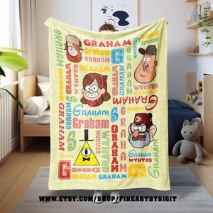 May include: A light yellow blanket featuring cartoon characters and the word "GRAHAM" in various colors and fonts. The blanket has a grid pattern and includes images of cartoon characters. The Etsy shop URL is visible at the bottom.