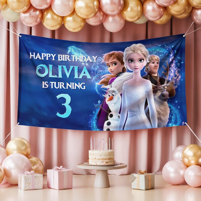 Puede incluir: Bandera azul con el texto "HAPPY BIRTHDAY OLIVIA IS TURNING 3" e im&aacute;genes de personajes de la pel&iacute;cula Frozen. La escena incluye globos y una tarta de cumplea&ntilde;os.