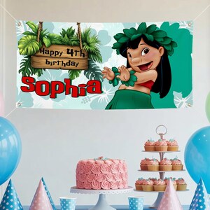 May include: A banner featuring a cartoon character, a wooden sign reading "Happy 4th birthday Sophia", and tropical foliage. The banner shows a cartoon character wearing a green skirt and a flower crown. A pink cake and cupcakes are on the table.