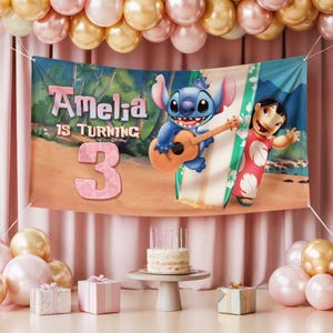 May include: A birthday banner with Stitch and Lilo from the animated film. The banner says "Amelia is turning 3" against a tropical beach backdrop. The scene includes a guitar, surfboard, and a cake with candles.