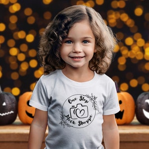 Kids T-Shirt Lifestyle Mockup White Bella+Canvas 3001T Autumn Girl Toddler Model in Crewneck Jersey Halloween Fall Jack-o-lantern Backdrop