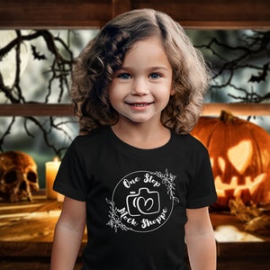 Kids T-Shirt Lifestyle Mockup Black Bella+Canvas 3001T Autumn Girl Toddler Model in Crewneck Jersey Halloween Fall Jack-o-lantern Backdrop