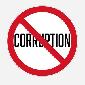 Könnte beinhalten: Ein runder weißer Aufkleber mit einem roten Kreis und einem roten diagonalen Strich. Das Wort "CORRUPTION" ist in fetten schwarzen Buchstaben über die Mitte des Aufklebers gedruckt.