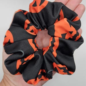 Halloween Scrunchie New Hair Tie Handmade Black Spandex with Orange Jack-o-Lantern Pumpkin Costume Outfit Fall. Size: Large.