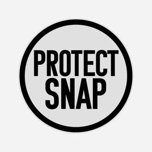 May include: A round sticker with the words "PROTECT SNAP" in bold, black capital letters. The text is centered on a light gray background, encircled by a thick black ring and a thin white ring.