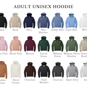 May include: A selection of adult unisex hoodies in various colors, including black, navy, and light pink. The image displays a range of hues, from forest green to charcoal, with the text "ADULT UNISEX HOODIE" at the top.