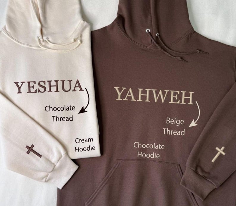 May include: Two hooded sweatshirts, one cream and one chocolate brown. The cream hoodie has "YESHUA" embroidered in chocolate thread, and a cross on the sleeve. The chocolate hoodie has "YAHWEH" embroidered in beige thread, and a cross on the sleeve.